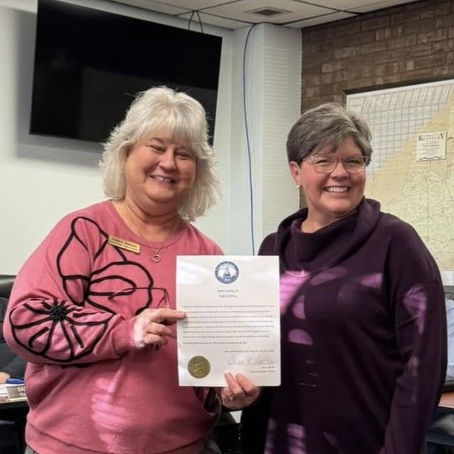 Judge Bottom congratulating Shannon Greene